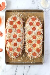 Two halves of French Bread pizza topped with pepperoni.