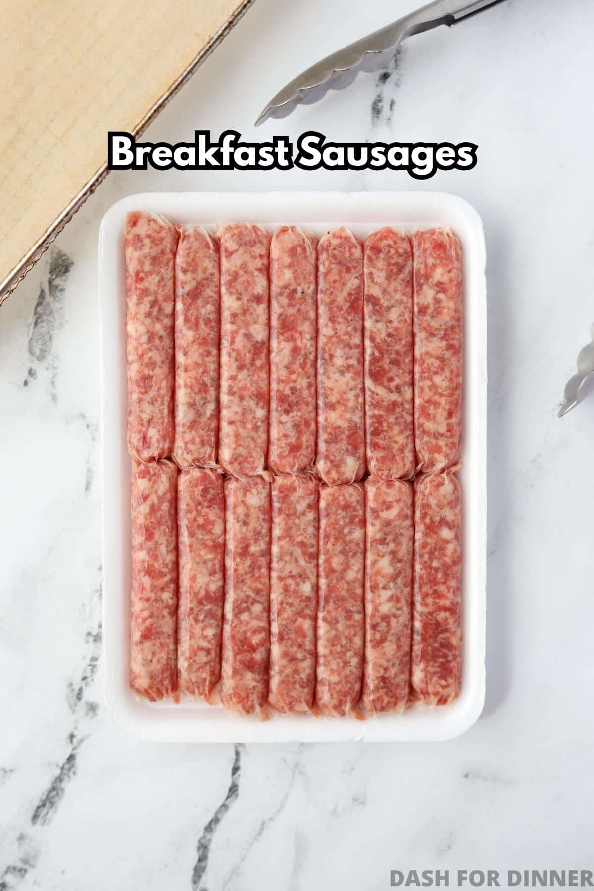 A styrofoam container filled with raw breakfast sausages.