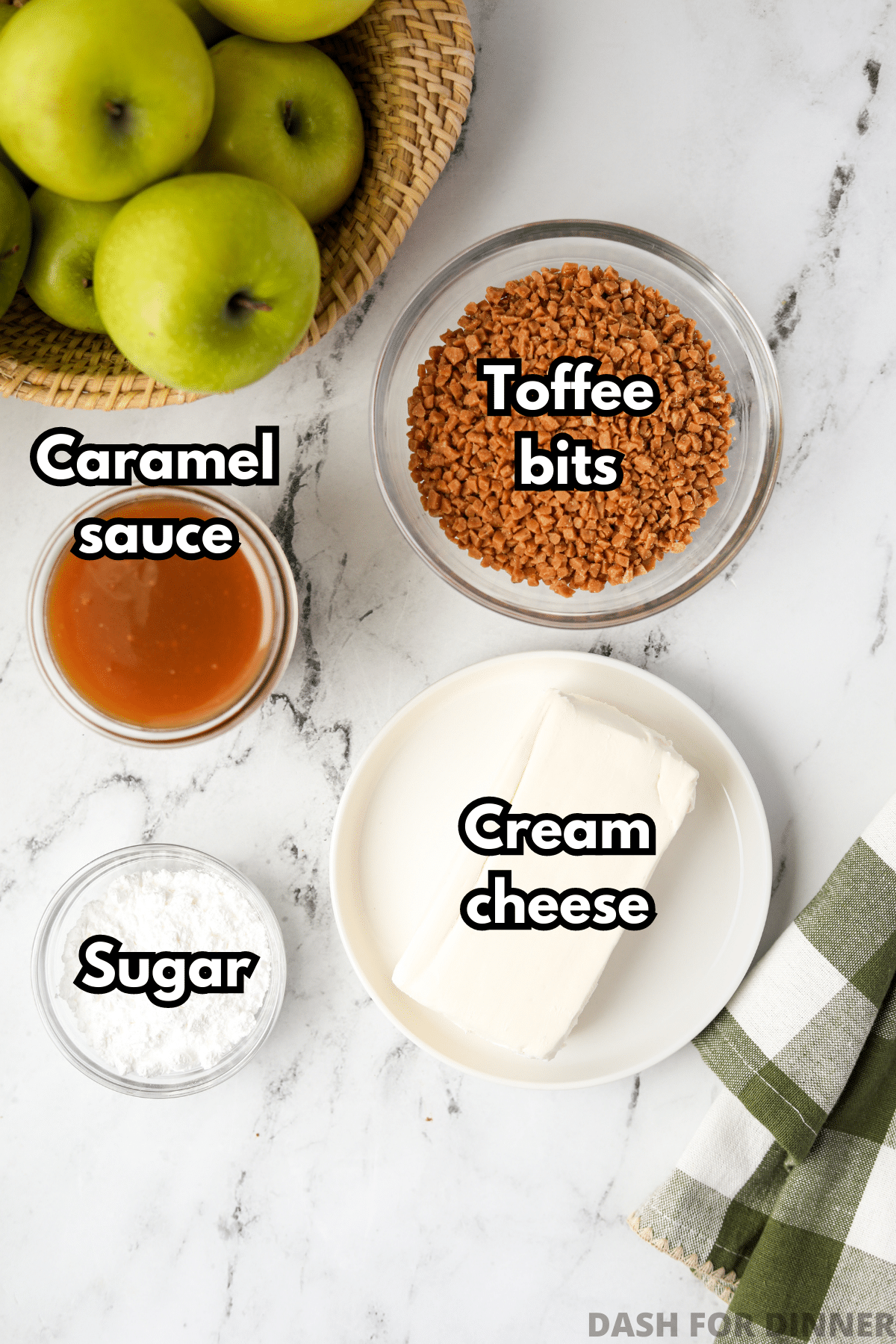 The ingredients needed to make caramel apple dip: caramel, cream cheese, toffee bits, sugar.