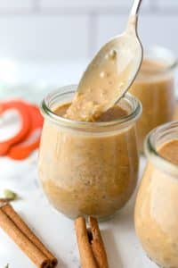 Spoon an overnight oatmeal mixture into a jar.