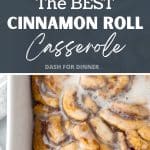 A baking dish filled with baked cinnamon roll pieces, and drizzled with icing.