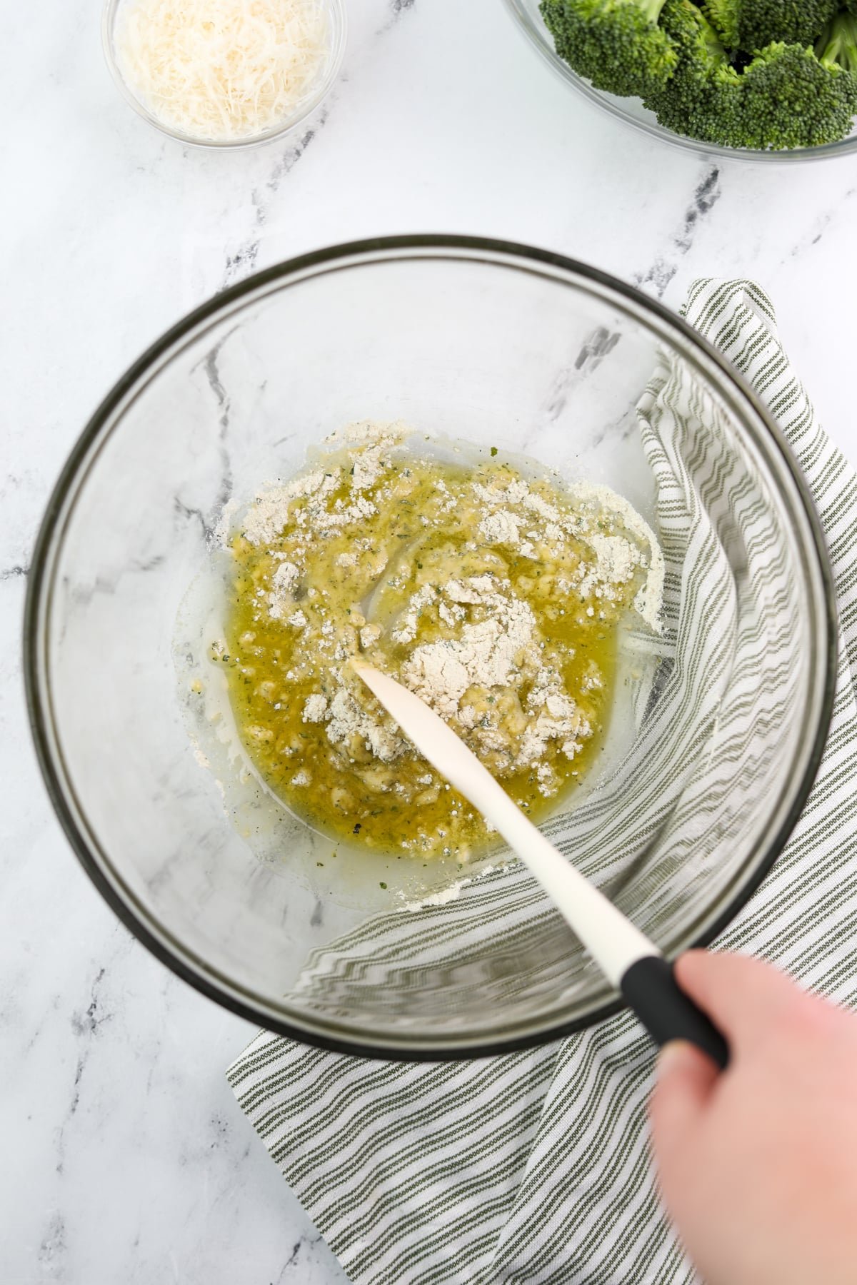 Stirring ranch seasoning into olive oil.