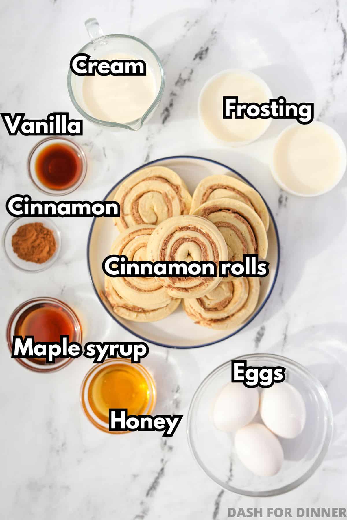 The ingredients needed to make cinnamon roll casserole (cinnamon rolls, frosting, eggs, heavy cream, etc).