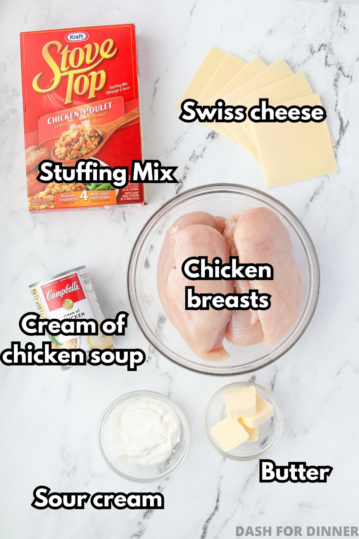 The ingredients needed to make chicken and stuffing: chicken breasts, cream of chicken soup, stuffing mix, butter, swiss cheese, and sour cream.