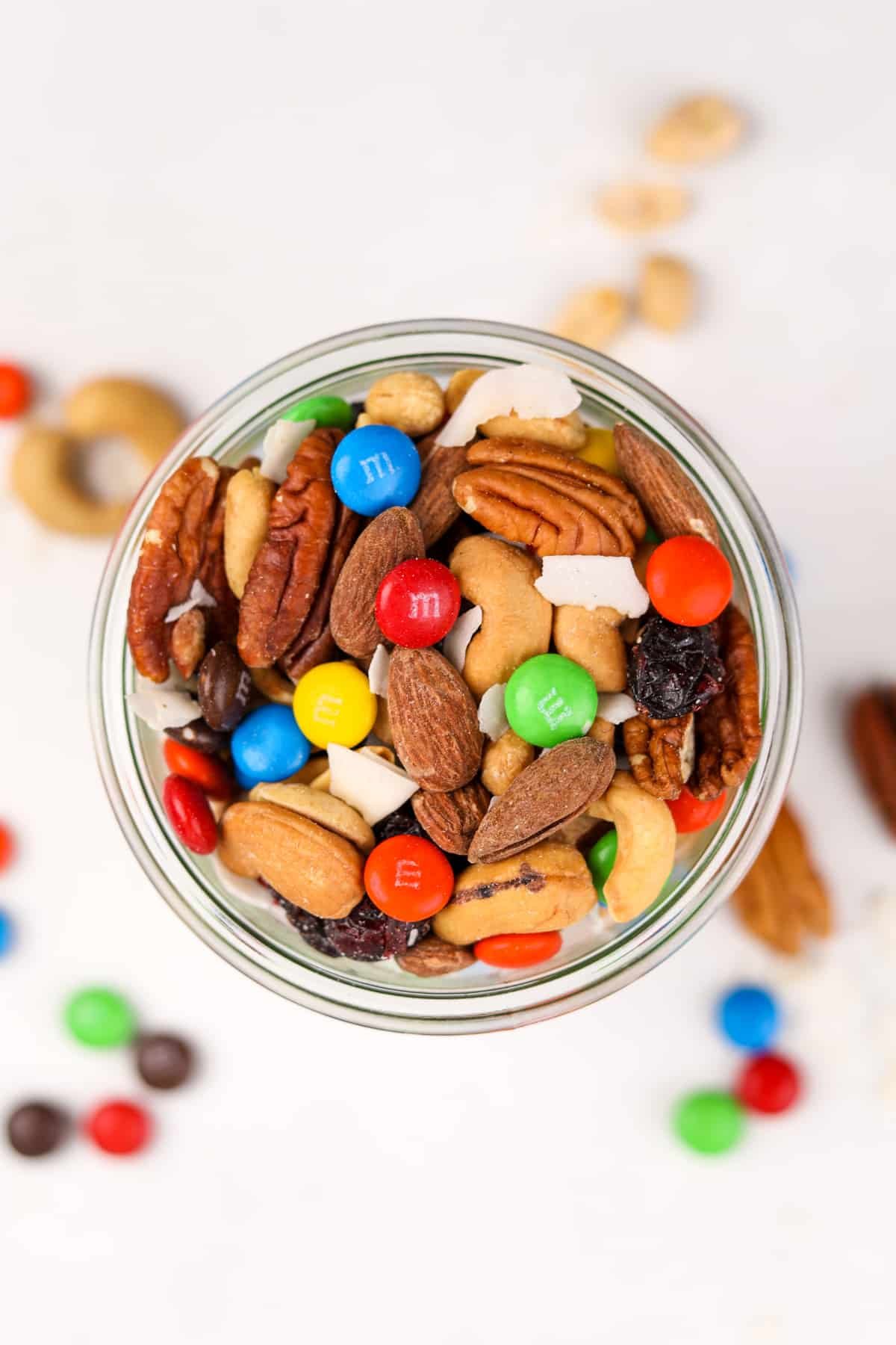 An overhead view of a mason jar filled with trail mix.