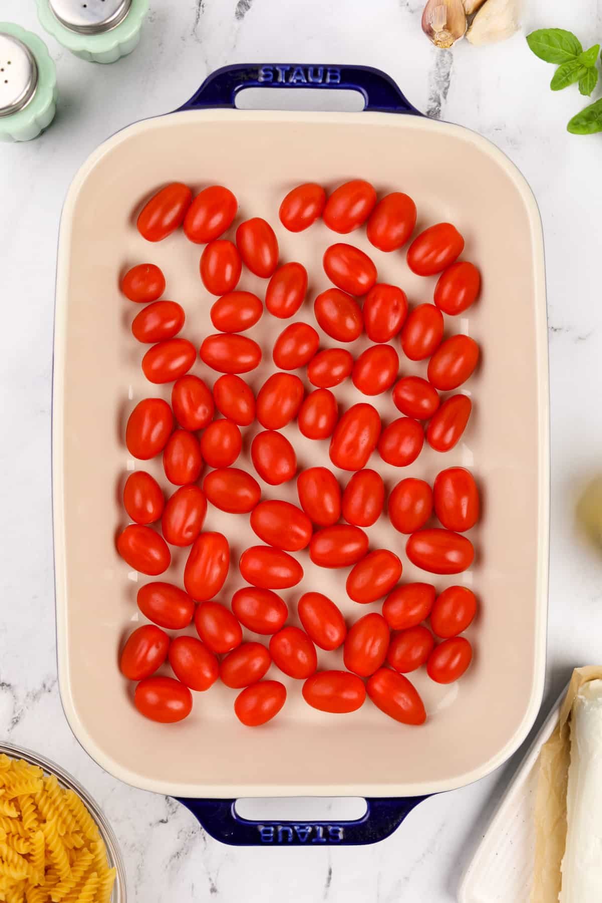 Cherry tomatoes in a baking dish.