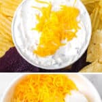 A bowl of creamy dip topped with shredded cheddar cheese.