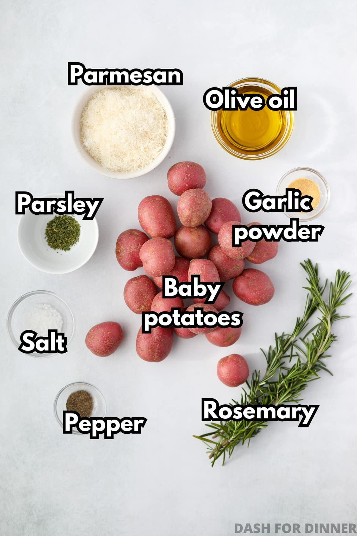 The ingredients needed to make roasted potatoes: olive oil, salt, pepper, baby potatoes, herbs and seasonings.