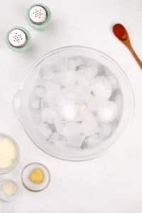 Eggs in a large bowl in an ice bath.