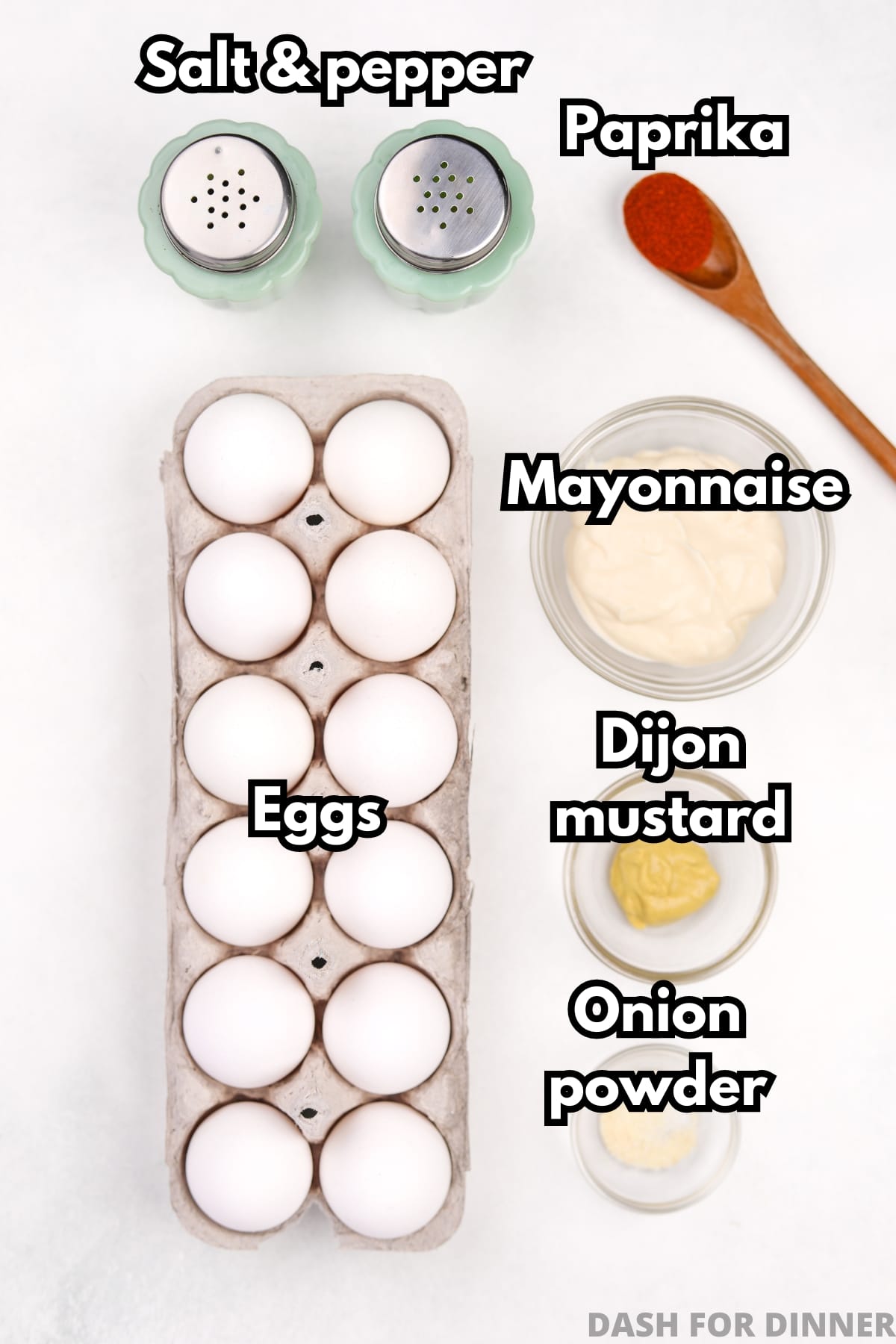 The ingredients needed to make deviled eggs, including mayo, dijon mustard, salt, pepper, and paprika.