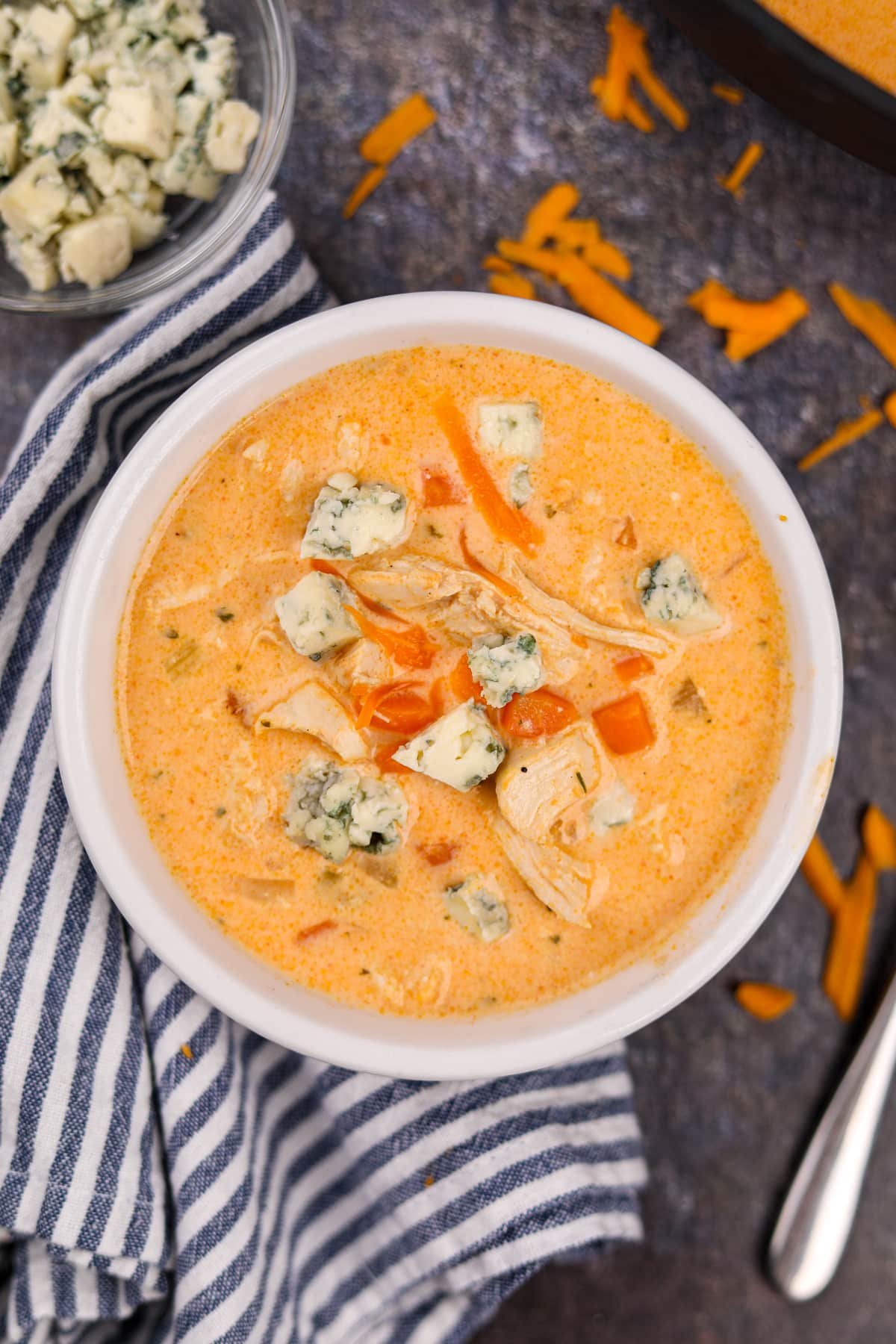 A bowl of buffalo soup topped with crumbled blue cheese.