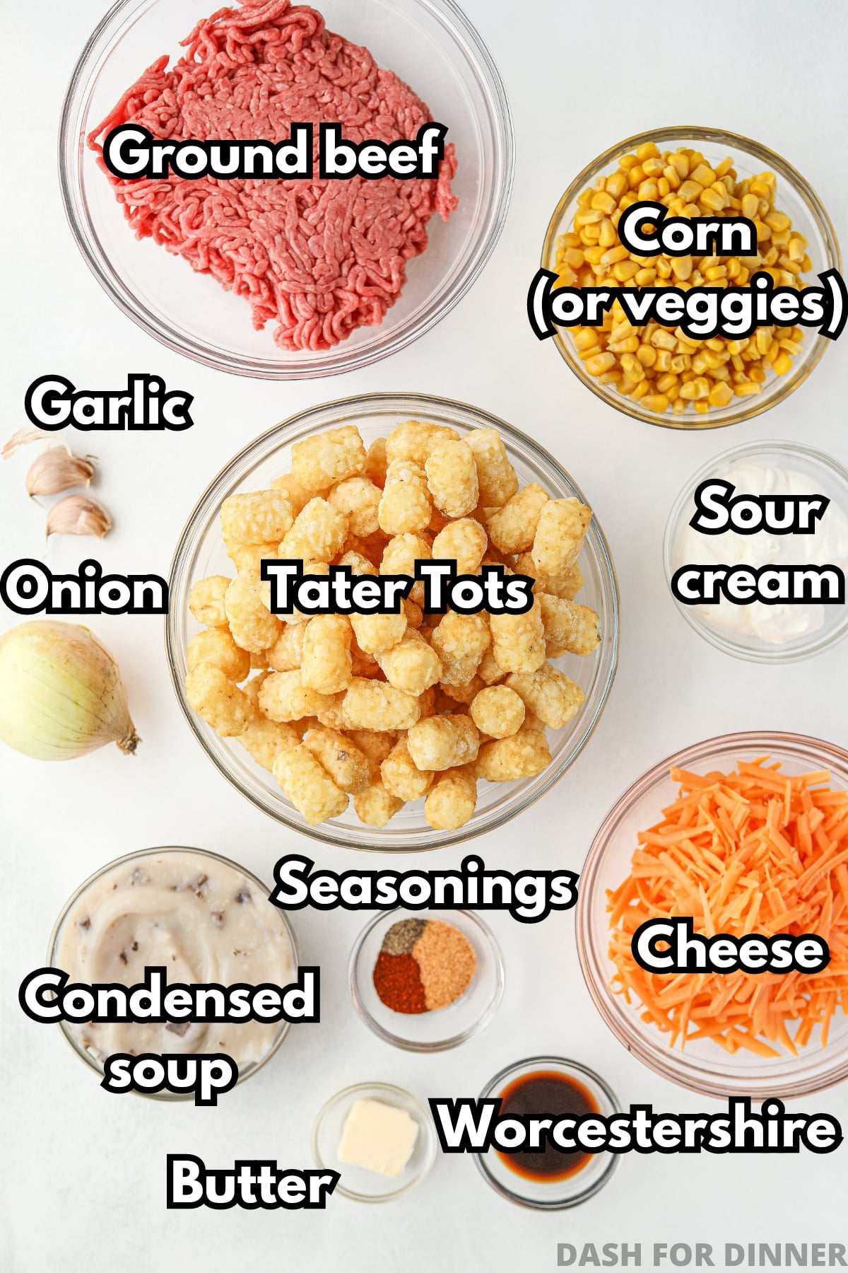 The ingredients needed to make ground beef tater tot casserole, including cheese, corn, condensed soup, and sour cream.