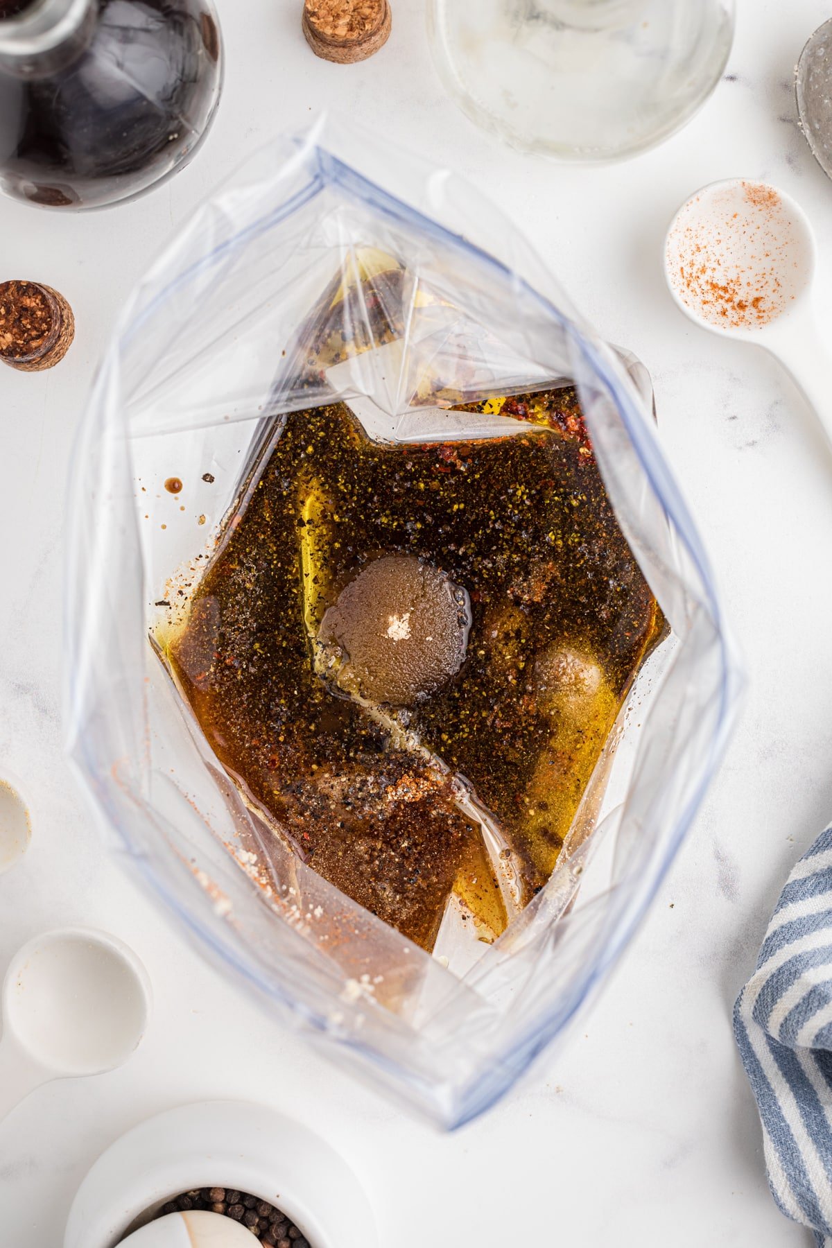 A freezer bag with a homemade marinade blend inside.