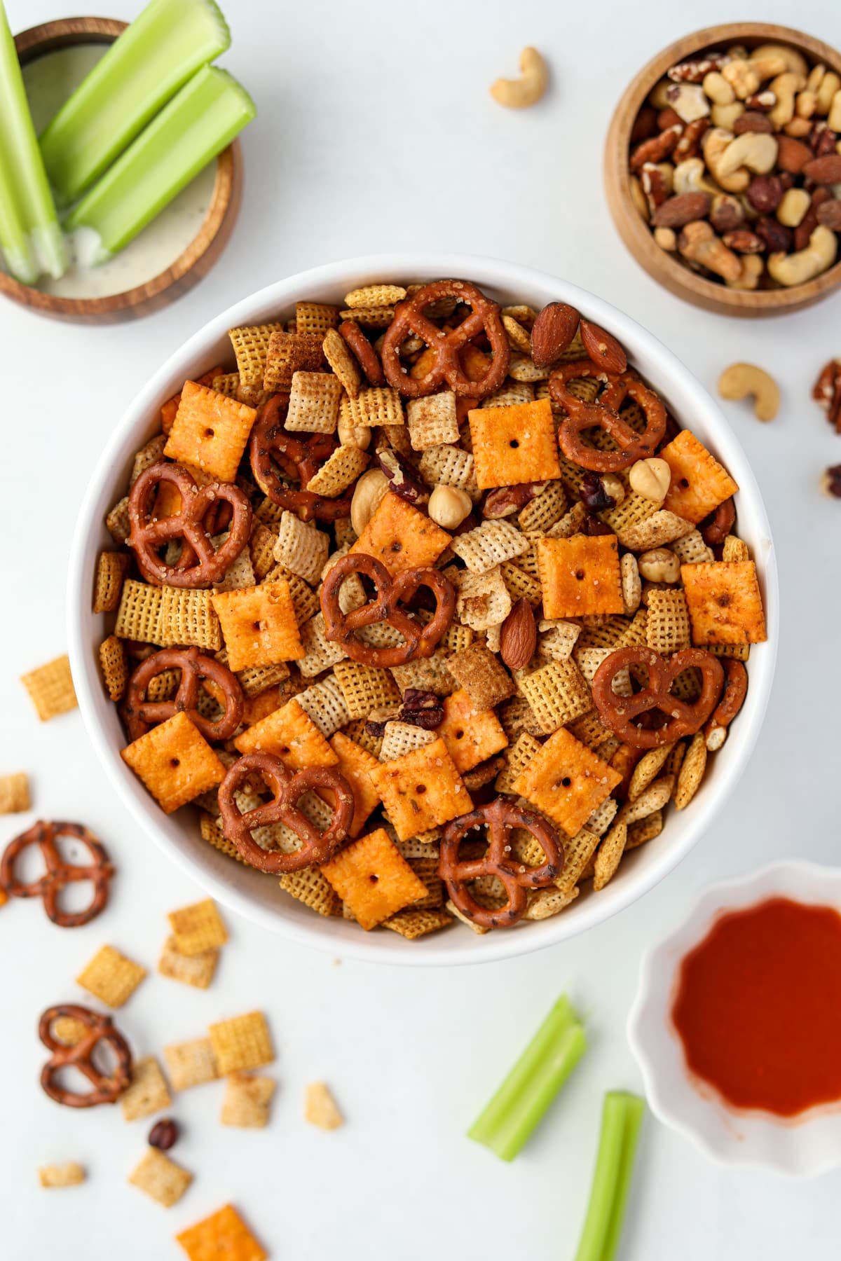 A white bowl filled with homemade snack mix.