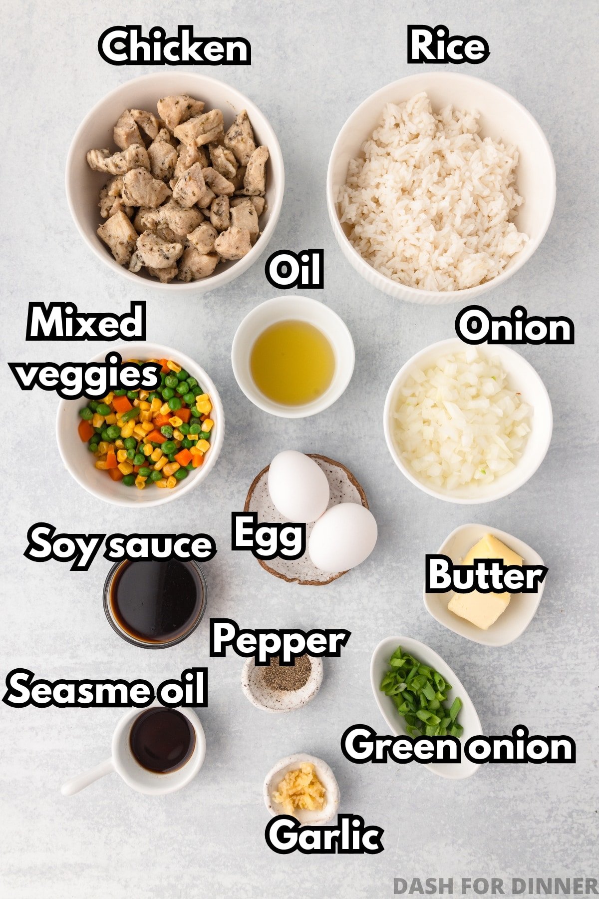 The ingredients needed to make chicken fried rice: bowls of rice, chicken, eggs, butter, etc.