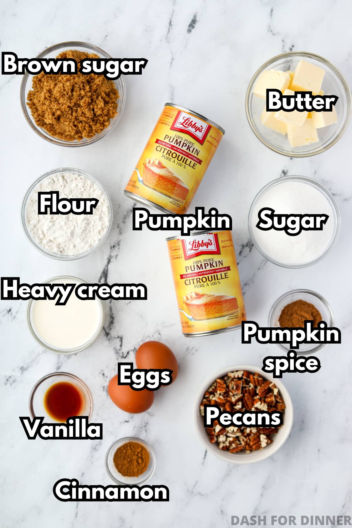 The ingredients needed to make pumpkin casserole, including pumpkin puree, heavy cream, pecans, brown sugar, and butter.