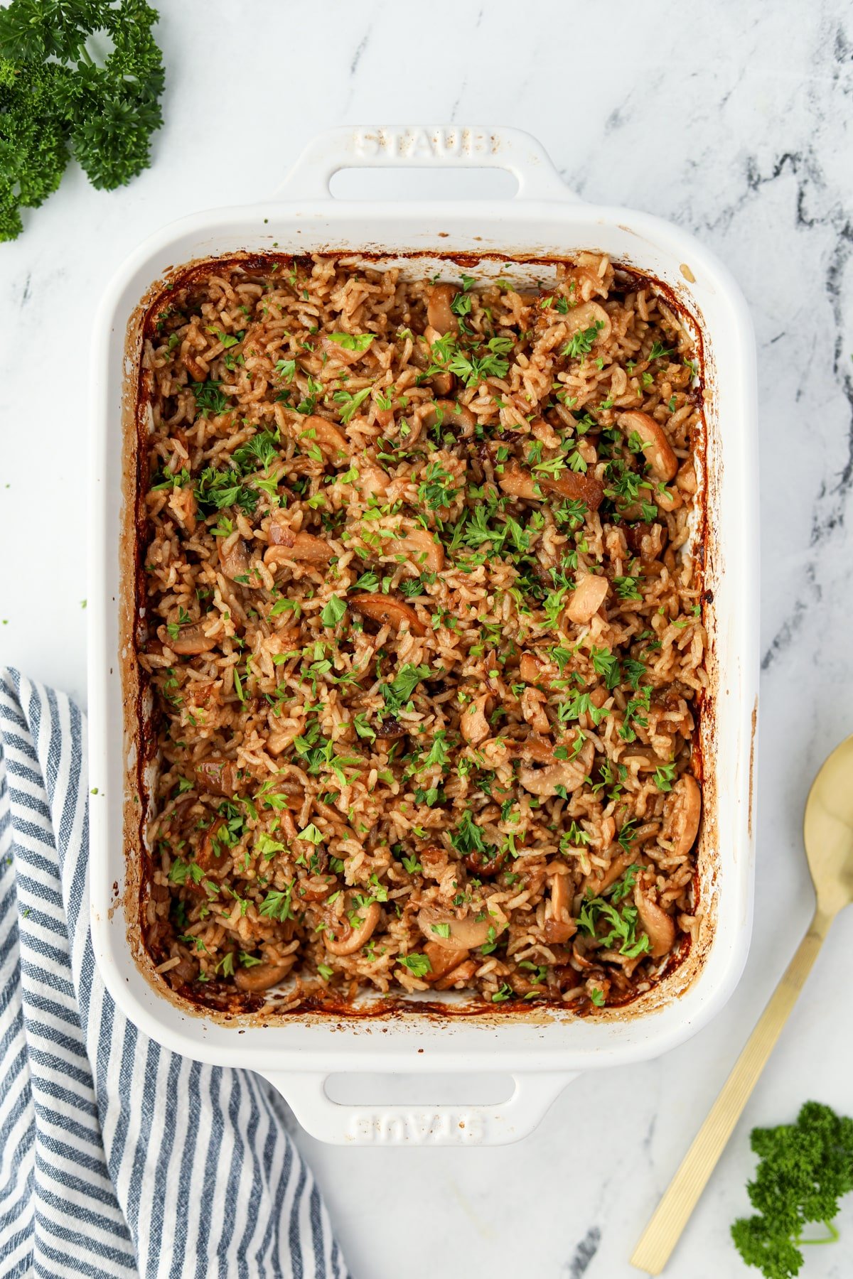 A baking dish filled with a rice casserole.