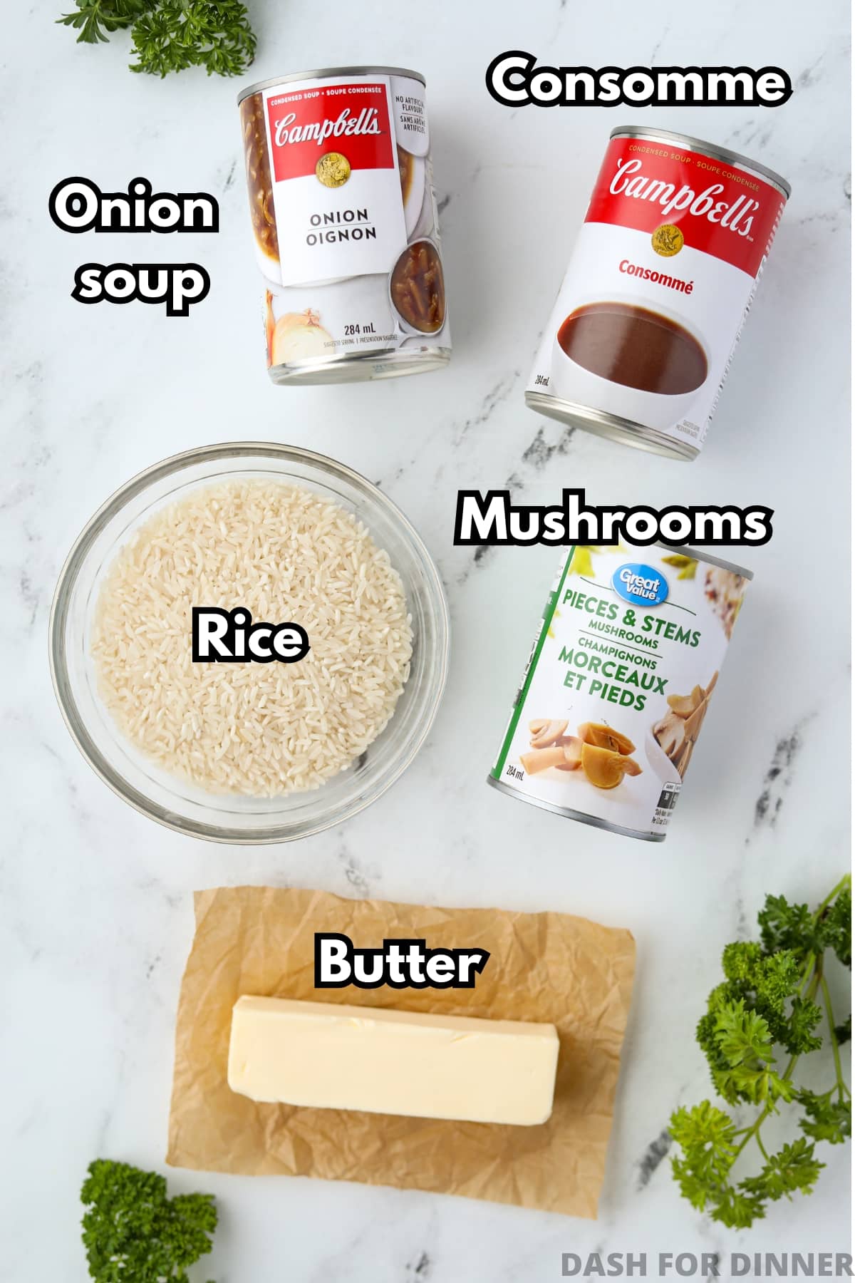 The ingredients needed to make stick of butter rice with mushrooms: rice, consomme, french onion soup, butter, and mushrooms.