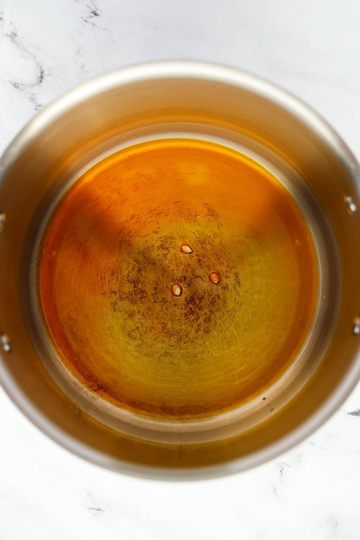 A large saucepan filled with oil.