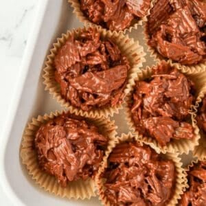 Muffin liners filled with chocolate potato chip clusters.