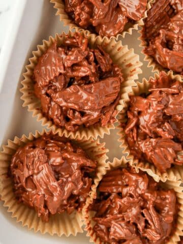 Muffin liners filled with chocolate potato chip clusters.