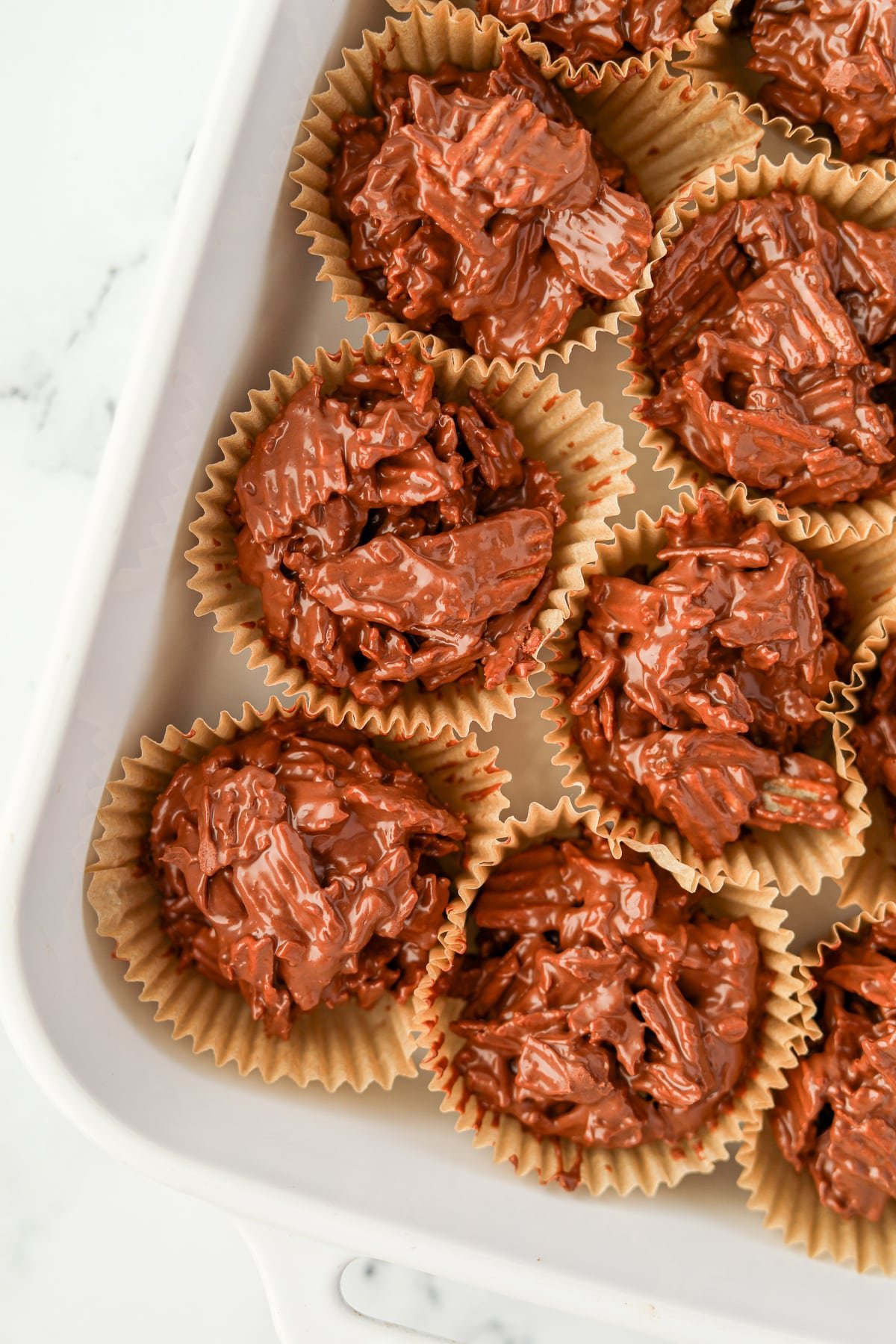 Chocolate and potato chip clusters in muffin liners.