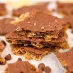 A stack of potato chip toffee topped with a thin layer of melted chocolate.