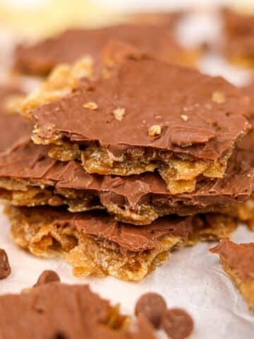 A stack of potato chip toffee topped with a thin layer of melted chocolate.