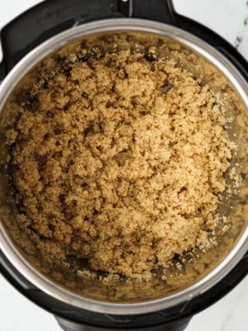 An Instant Pot with cooked quinoa in the insert.