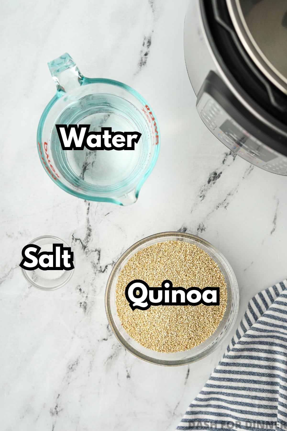 A measuring cup with water, then small bowls with quinoa and salt.