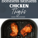 An air fryer basket with cooked chicken thighs inside.