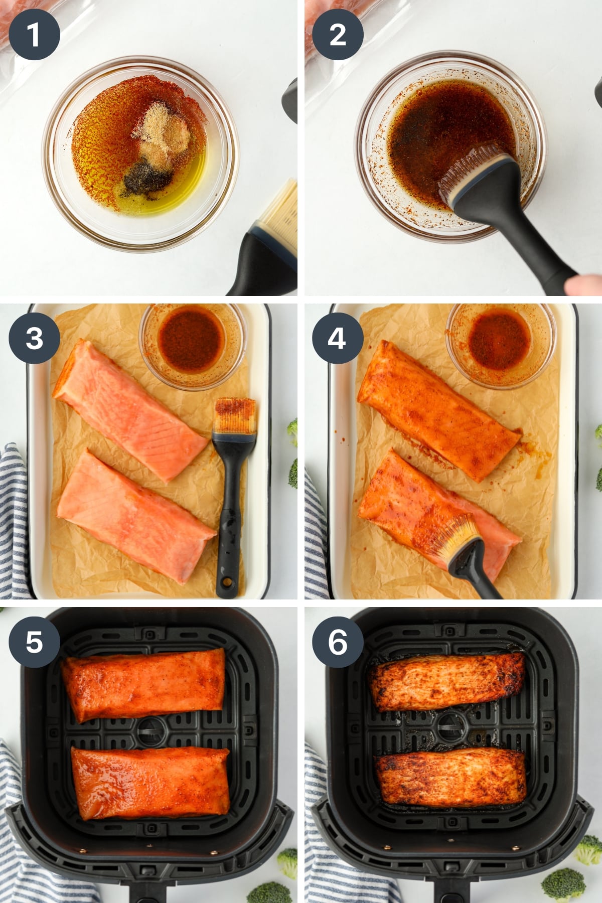 Brushing a seasoned oil on top of frozen salmon fillets, then placing them in an air fryer basket. 