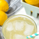 A glass of lemonade filled with ice.