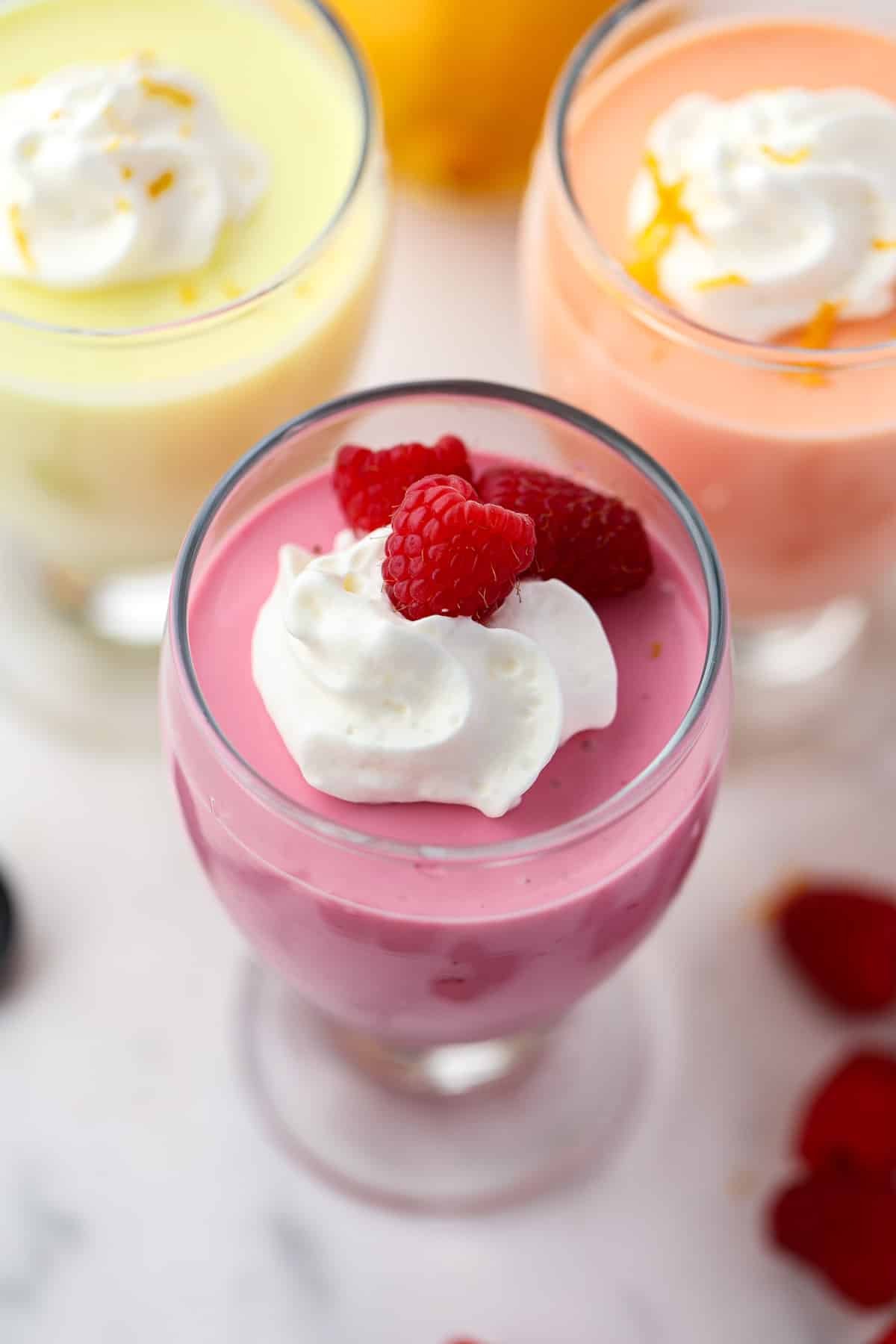 Parfait glasses filled with yogurt jello mousse. 