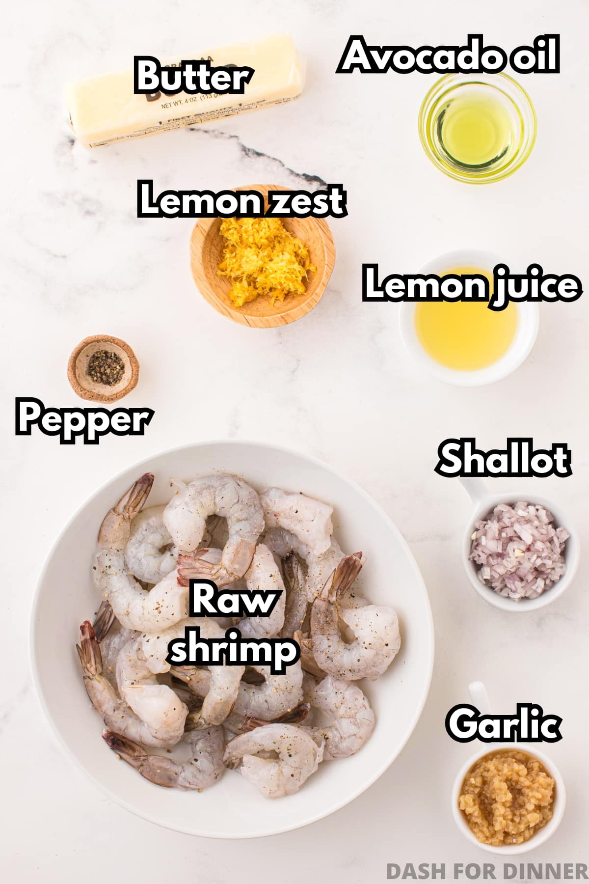 A bowl of shrimp, plus various ingredients including minced garlic, lemon zest, and butter.