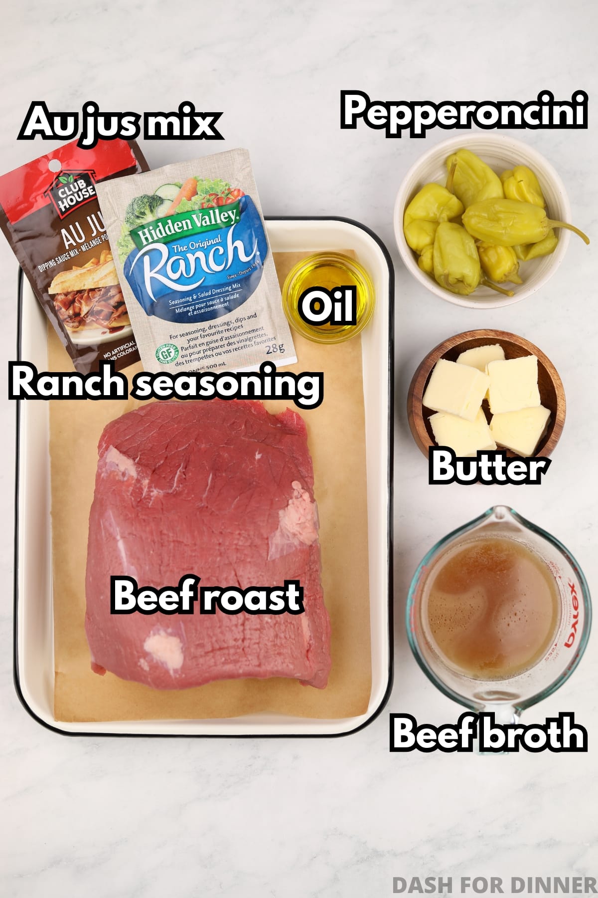 The ingredients needed to make Mississippi roast: beef roast, ranch mix, au just mix, butter, pepperoncini peppers, butter, and a oil.