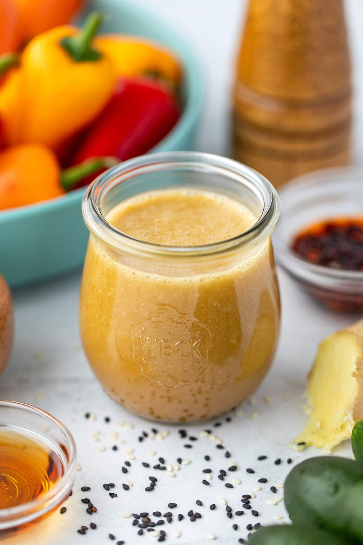 A small jar filled with homemade sesame ginger dressing.