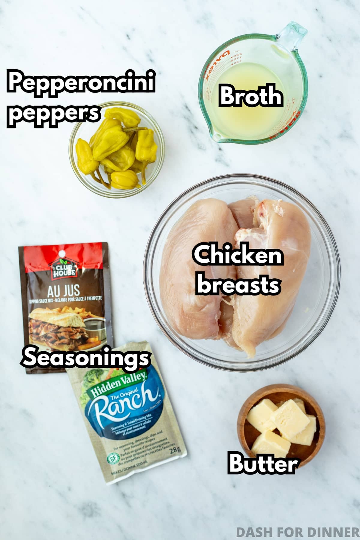 The ingredients needed to make Mississippi chicken, including ranch mix and au jus mix.