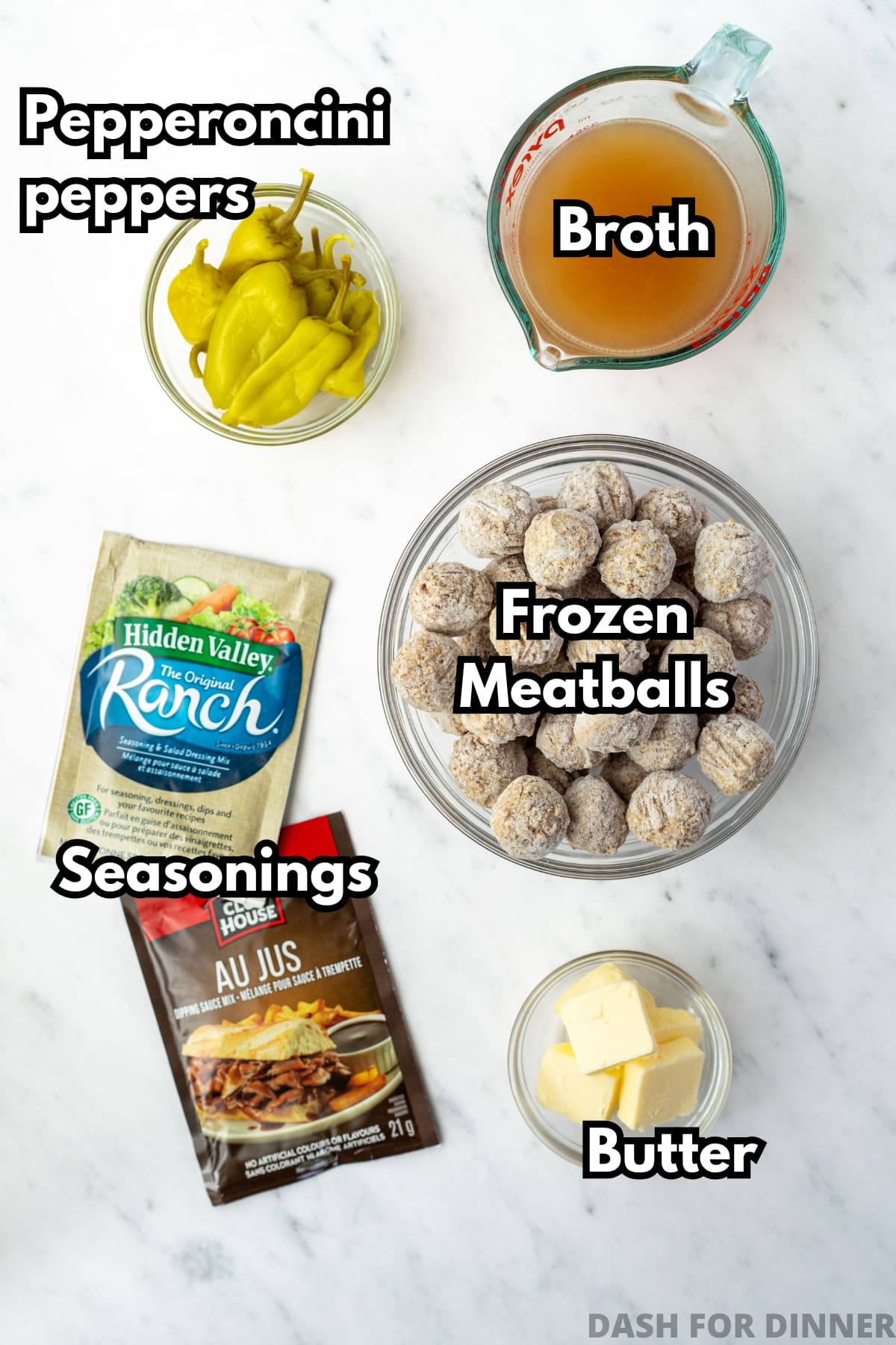The ingredients needed to make mississippi meatballs, including frozen meatballs, ranch seasoning, butter, broth, and au jus seasoning.