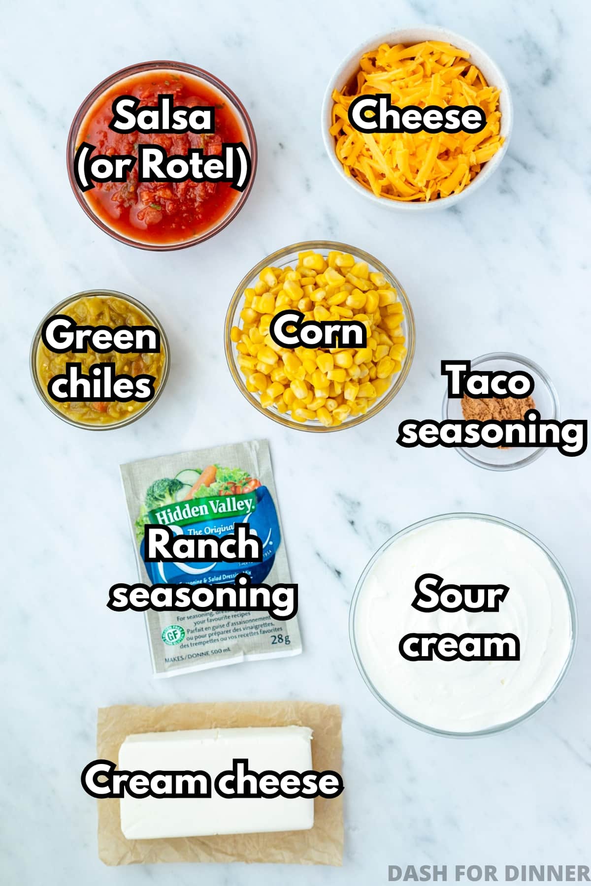 The ingredients needed to make boat dip, including cream cheese, sour cream, cheddar cheese, and ranch seasoning.