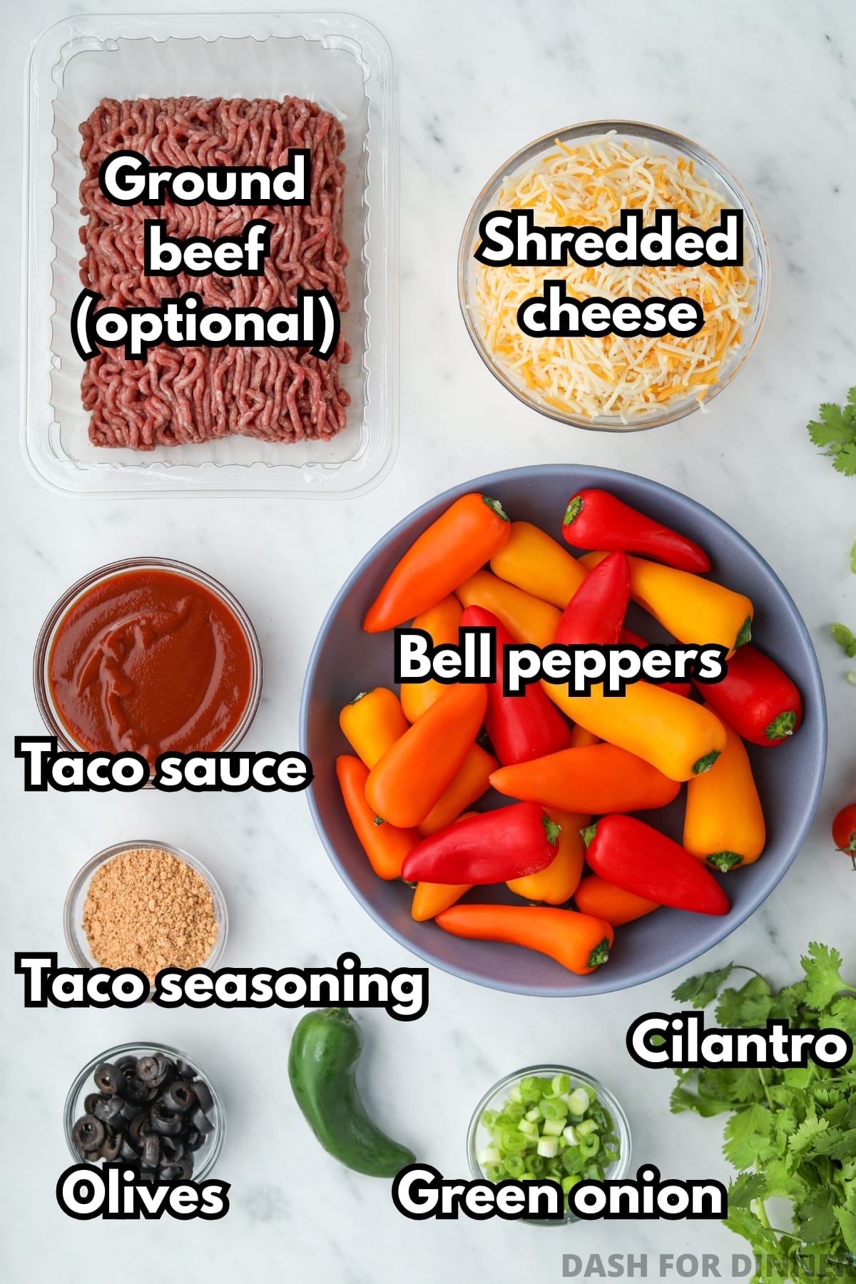 The ingredients needed to make bell pepper nachos, including cheese, taco seasoning, cilantro, and jalapeno.