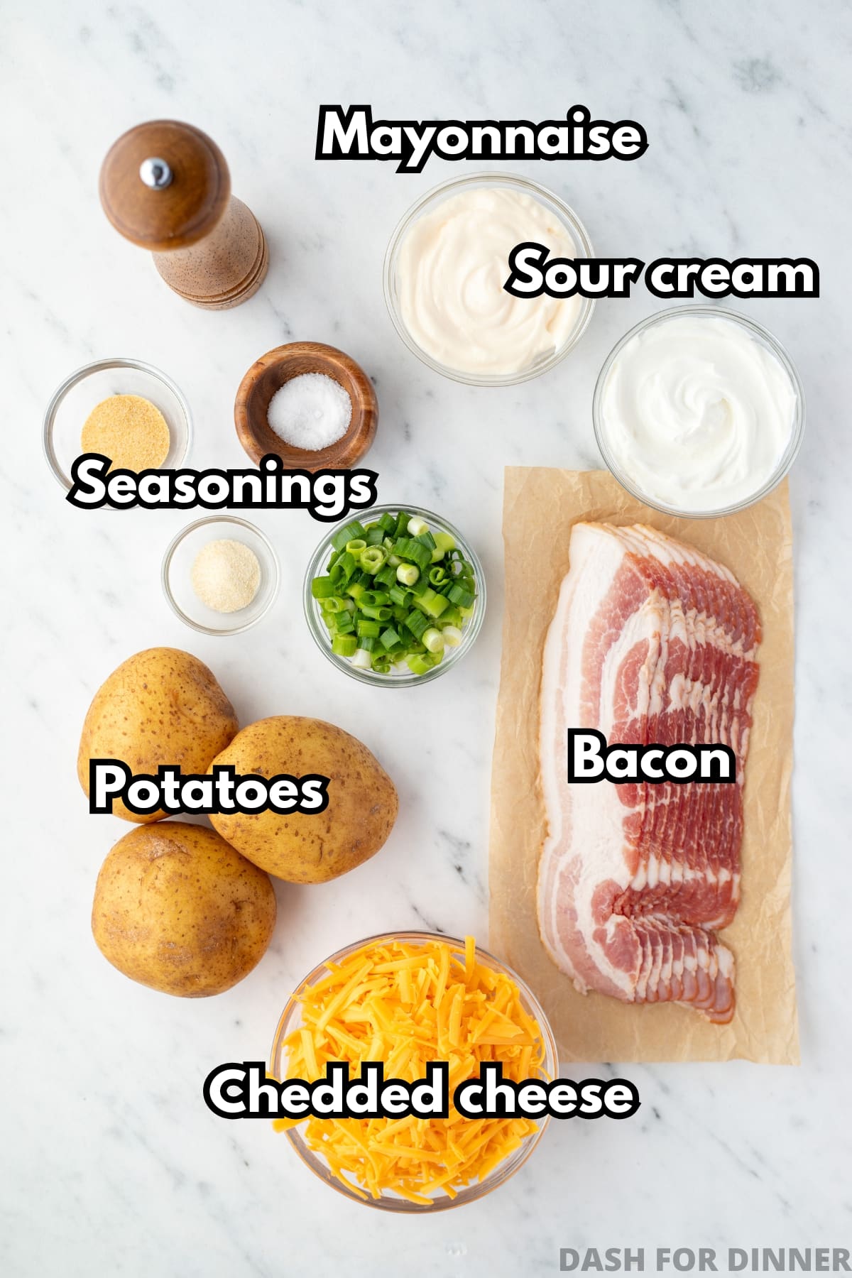 The ingredients needed to make Mississippi Mud potatoes, including cheese, bacon, sour cream, and mayonnaise.