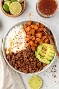 A bowl with ground beef, cottage cheese, and sweet potatoes.