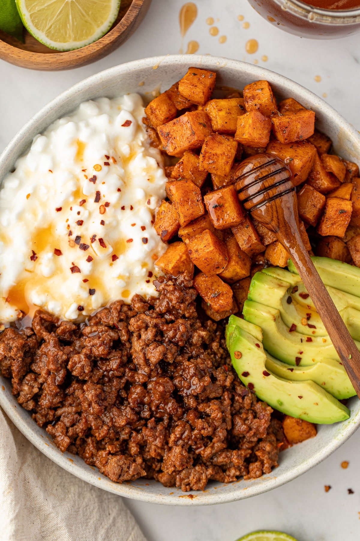 A protein bowl with ground beef, cottage cheese, and avocado.
