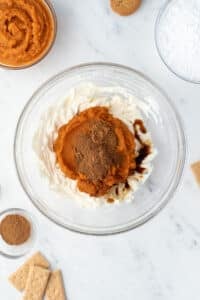 A bowl of whipped cream cheese with pumpkin, spices, vanilla, etc.