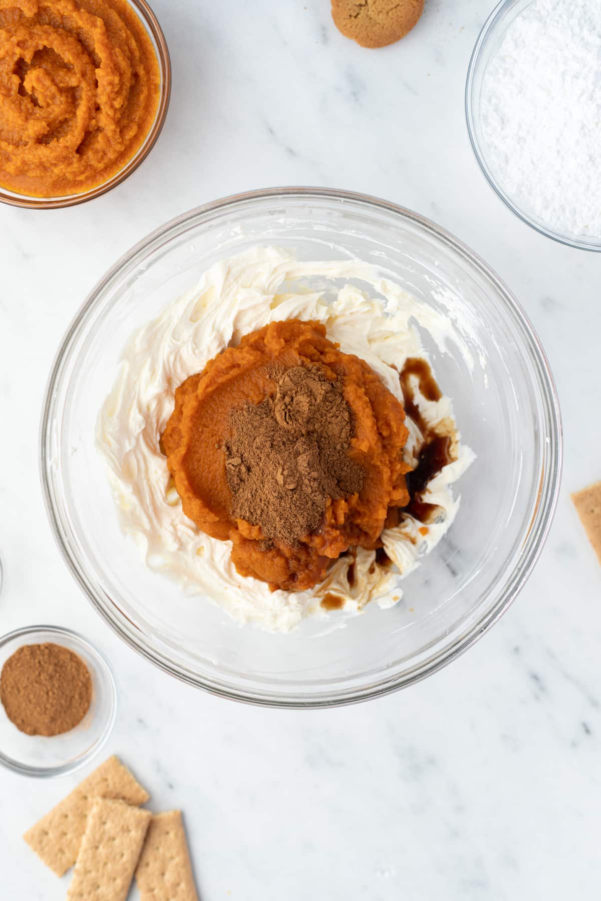 A bowl of whipped cream cheese with pumpkin, spices, vanilla, etc.