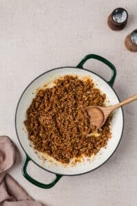A skillet filled with seasoned ground beef.