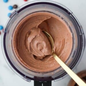 Spooning soft chocolate ice cream from a Ninja Creami container.