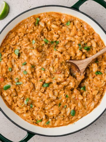 A skillet filled with taco macaroni and cheese.