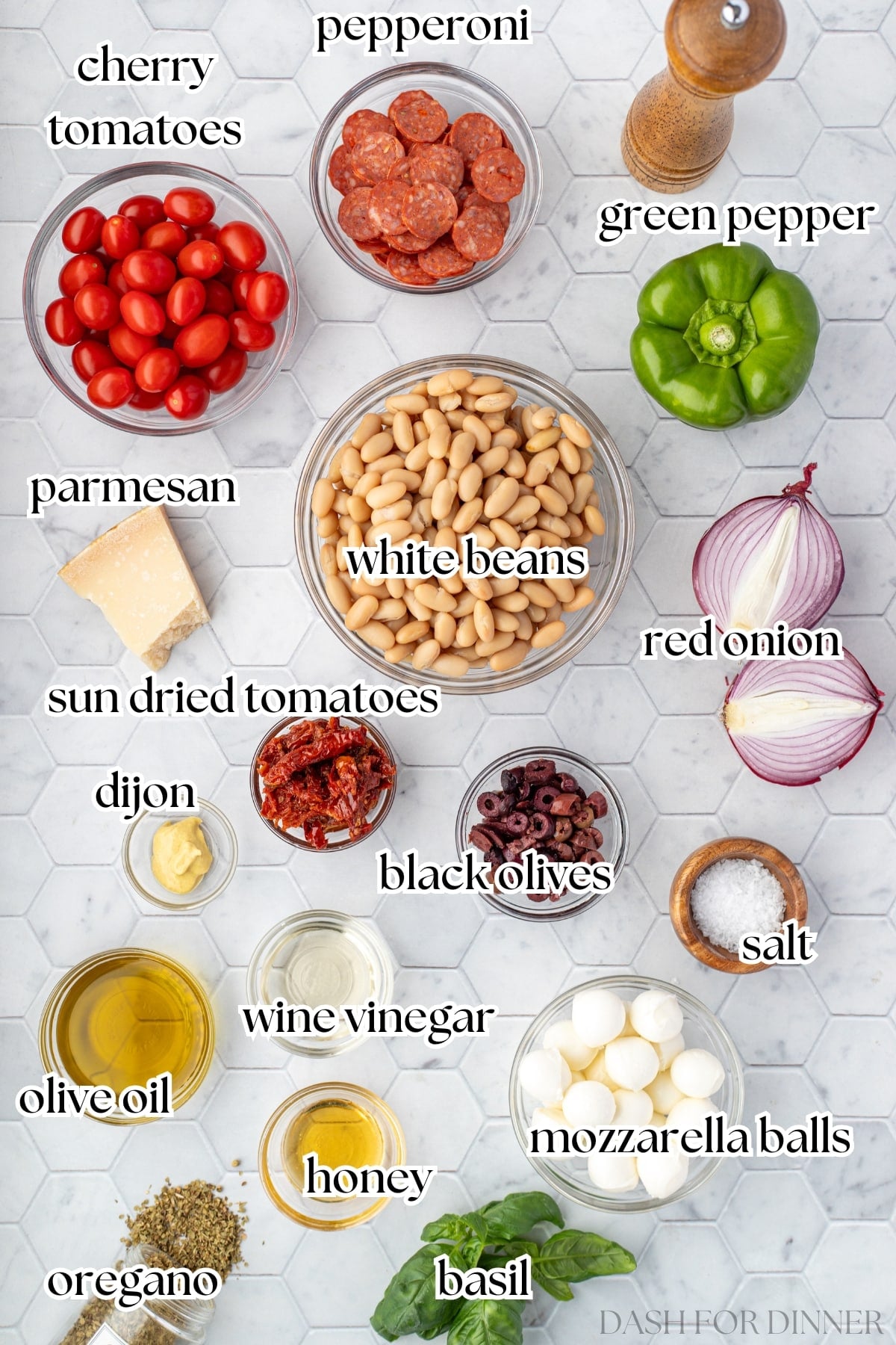 The ingredients needed to make pizza bean salad, including beans, mozzarella, and pepperoni.